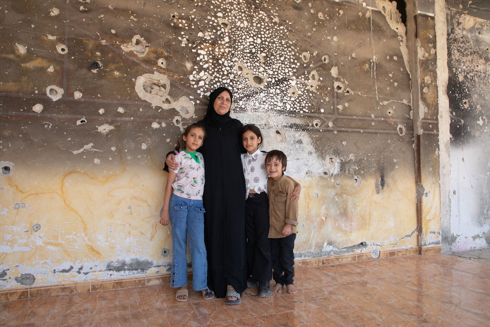 Syria_Basmah-and-Islam-in-their-damaged-home